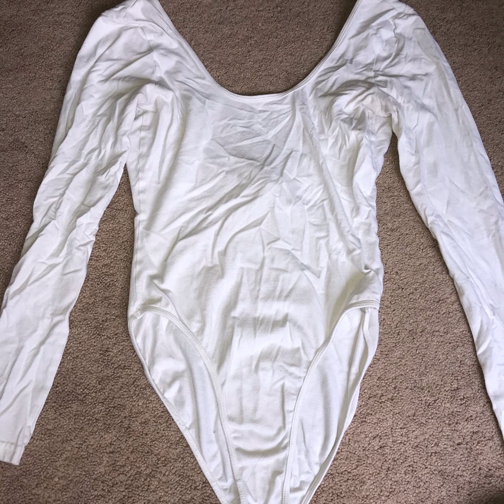 white long sleeve body suit with a dipped back